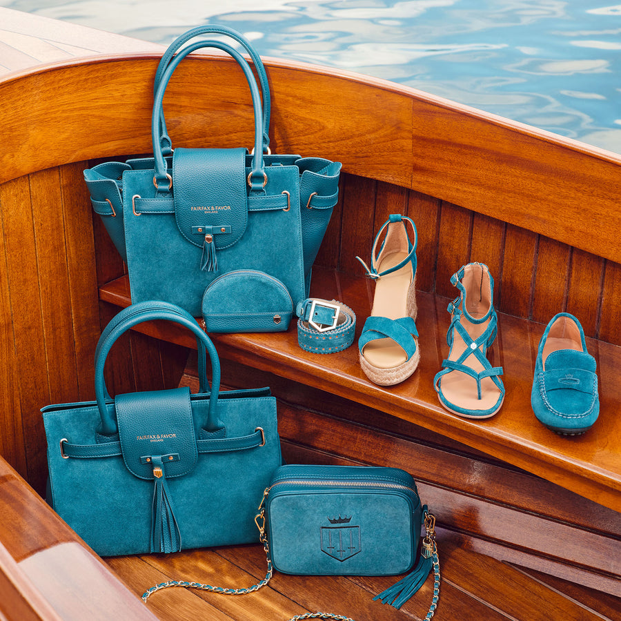 the ocean blue collection all together while on a boat in sunshine. 