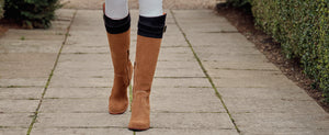 picture of the olympia boots in tan and navy suede. 